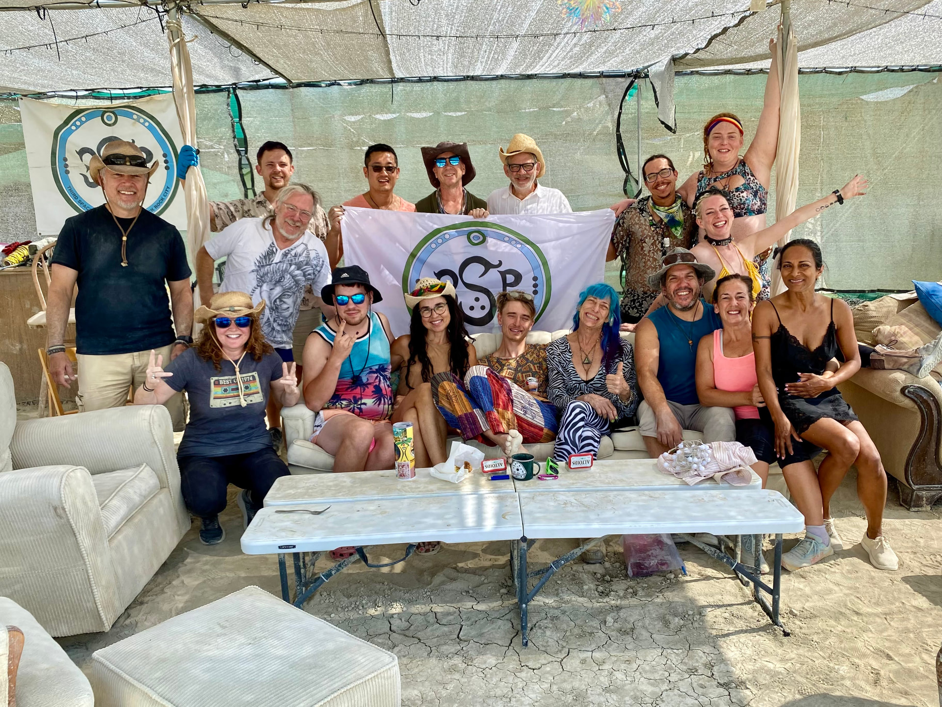 Vivarium campers gathered behind the 3SP flag under shade cloth, 2025